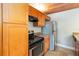 Kitchen with stainless steel appliances, light wood cabinets and dark countertops at 510 Cranes Way # 306, Altamonte Springs, FL 32701