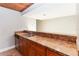 Kitchenette with a stainless steel sink, wood cabinets, and tan countertops at 510 Cranes Way # 306, Altamonte Springs, FL 32701