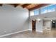 Bright living room with a high wood ceiling, tile floors, and natural light; open floorplan to kitchen with bar at 510 Cranes Way # 306, Altamonte Springs, FL 32701