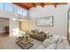 Bright living room featuring exposed wood beams, modern decor, and large windows at 510 Cranes Way # 306, Altamonte Springs, FL 32701