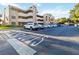 Exterior view of condo complex with ample parking and well-maintained landscaping at 510 Cranes Way # 306, Altamonte Springs, FL 32701