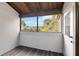 Relaxing screened patio with wood ceiling and lake view through large window at 510 Cranes Way # 306, Altamonte Springs, FL 32701