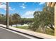 Scenic view of a tranquil lake surrounded by lush greenery from a large window at 510 Cranes Way # 306, Altamonte Springs, FL 32701