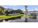 A tranquil aerial view showcasing the waterfront property with a private dock and lush greenery at 6009 Lady Bet Dr, Orlando, FL 32819