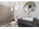 Modern bathroom boasts a frameless glass shower, unique mirror, and sleek vanity at 6009 Lady Bet Dr, Orlando, FL 32819