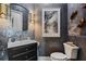 Striking powder room featuring unique wall texture and designer fixtures at 6009 Lady Bet Dr, Orlando, FL 32819