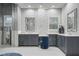 Modern bathroom featuring dual vanities, sleek fixtures, and a stylish blue accent chair at 6009 Lady Bet Dr, Orlando, FL 32819