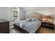 Cozy bedroom features a large window with shutters and a well-lit nightstand at 6009 Lady Bet Dr, Orlando, FL 32819