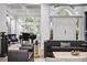 Grand foyer with soaring ceilings, arched windows, a crystal chandelier, and an elegant seating area at 6009 Lady Bet Dr, Orlando, FL 32819