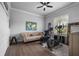 Home gym with modern exercise equipment, comfortable seating, and natural light at 6009 Lady Bet Dr, Orlando, FL 32819