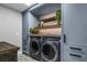 Neat laundry room area with front loading washer and dryer and decorative details at 6009 Lady Bet Dr, Orlando, FL 32819