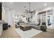 Open-concept living room with stylish lighting, modern decor, and access to the outdoor patio at 6009 Lady Bet Dr, Orlando, FL 32819