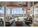 Open living room with high ceilings, large windows, and outdoor views, perfect for entertaining at 6009 Lady Bet Dr, Orlando, FL 32819