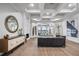 Bright and airy living room with tray ceilings, fireplace, and an open floor plan to the dining area at 6009 Lady Bet Dr, Orlando, FL 32819