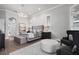 Spacious bedroom features a chandelier, arched doorway, and stylish gray furnishings at 6009 Lady Bet Dr, Orlando, FL 32819
