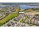 Birds-eye view of a neighborhood with a lake nearby and community amenities, showcasing a well-located residence at 15542 Sunquat Dr, Winter Garden, FL 34787