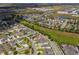 Aerial shot shows house in a Gathering neighborhood featuring modern homes, and neatly landscaped yards at 15542 Sunquat Dr, Winter Garden, FL 34787