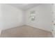 Neutral bedroom featuring carpeted flooring and a view from the window at 15542 Sunquat Dr, Winter Garden, FL 34787