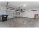 Spacious two-car garage with overhead storage racks, ready for customization and organization at 15542 Sunquat Dr, Winter Garden, FL 34787