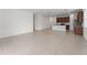 Spacious living room features tile floors that leads to the kitchen, creating an open floorplan at 15542 Sunquat Dr, Winter Garden, FL 34787
