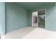 Private outdoor patio area with sliding glass door, perfect for relaxation and entertainment at 15542 Sunquat Dr, Winter Garden, FL 34787