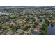 This home is nestled in a tree-lined neighborhood near a community lake and amenities at 807 Grovesmere Loop, Ocoee, FL 34761