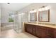 Bathroom features a walk-in shower, soaking tub, double vanity with granite countertop, and tile floors at 807 Grovesmere Loop, Ocoee, FL 34761