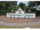 Community sign for Windermere Groves subdivision with festive holiday decorations at 807 Grovesmere Loop, Ocoee, FL 34761