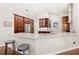 Kitchen bar with stainless appliances, granite countertops, and a breakfast bar at 807 Grovesmere Loop, Ocoee, FL 34761