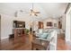 Open living room with hardwood floors, comfortable seating, and easy access to the kitchen and outdoor areas at 807 Grovesmere Loop, Ocoee, FL 34761