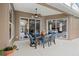 Spacious outdoor patio with seating, ceiling fan, and views into the home at 807 Grovesmere Loop, Ocoee, FL 34761