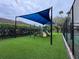 Community playground for , set on lush artificial turf, ensures year-round enjoyment at 807 Grovesmere Loop, Ocoee, FL 34761
