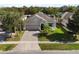 A home exterior with an attached garage, paved driveway, and manicured yard at 12079 Alder Branch Loop, Orlando, FL 32824
