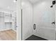 Contemporary bathroom with a glass-enclosed shower and custom storage solutions at 347 Mission Rd, Oviedo, FL 32765