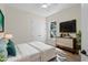 Bright bedroom with hardwood floors, a large closet, a dresser, and a window with a view of nature at 347 Mission Rd, Oviedo, FL 32765