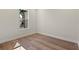 Cozy room features hardwood floors, white trim, and a bright window at 347 Mission Rd, Oviedo, FL 32765