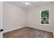 Bedroom with wood floors and window providing natural light at 347 Mission Rd, Oviedo, FL 32765