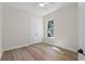 Bedroom with closet space and window providing natural light at 347 Mission Rd, Oviedo, FL 32765