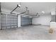 Spacious three car garage with newly painted walls and sealed concrete flooring at 347 Mission Rd, Oviedo, FL 32765