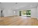Bright living room with hardwood floors, recessed lighting, and access to the backyard through sliding glass doors at 347 Mission Rd, Oviedo, FL 32765