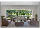 Covered outdoor patio with a furniture set perfect for enjoying the view of the backyard and nearby swimming pool at 347 Mission Rd, Oviedo, FL 32765