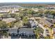 An aerial view of the community and surrounding area, including roads and other buildings at 4408 Sun Village Blvd, Kissimmee, FL 34746