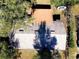 Aerial view of house with gray roof and trees providing shade at 849 Orange Oak Dr, Orange City, FL 32763