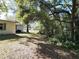 Lush backyard showcasing mature trees, offering a serene outdoor space at 849 Orange Oak Dr, Orange City, FL 32763