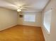 Cozy bedroom with window, fan, and laminate wood flooring that gives the space a bright airy feel at 849 Orange Oak Dr, Orange City, FL 32763