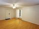 Bright bedroom with laminate wood flooring, a ceiling fan, and sliding glass doors to the outside at 849 Orange Oak Dr, Orange City, FL 32763