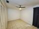 Bright bedroom featuring neutral walls, tile flooring, and a modern ceiling fan at 849 Orange Oak Dr, Orange City, FL 32763