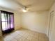 Neutral bedroom with a ceiling fan and tile flooring, offering a blank canvas at 849 Orange Oak Dr, Orange City, FL 32763