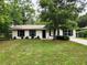 Charming single-story home featuring a well-maintained lawn and mature shade tree at 849 Orange Oak Dr, Orange City, FL 32763