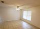 Neutral living room featuring tile floors, ceiling fan, and a window that gives lots of natural light at 849 Orange Oak Dr, Orange City, FL 32763